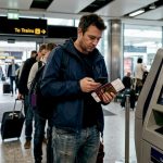 Airport currency exchange traveller in queue